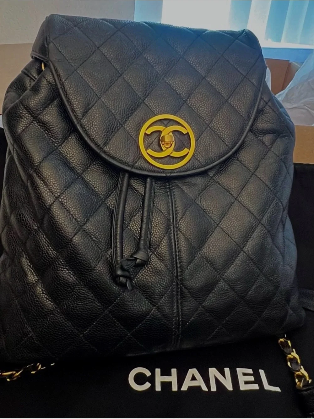 CHANEL Black Quilted Leather Backpack with Gold CC Accent